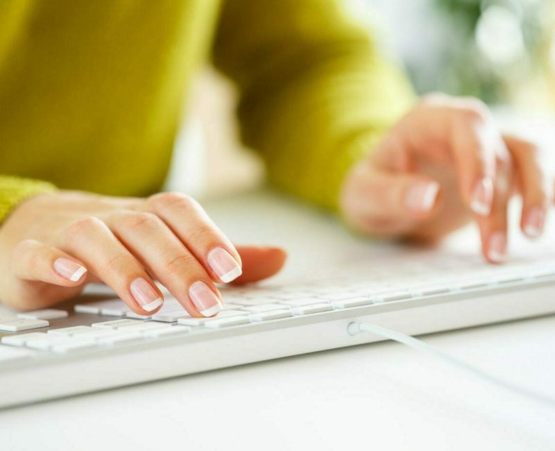 woman-office-worker-typing-on-the-keyboard-2021-08-26-16-25-21-utc-scaled-1.jpg